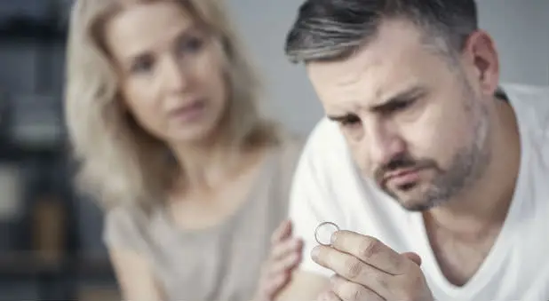 divorce readiness: husband looking at ring